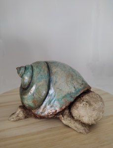 Bébé coquillage - Argile cuite patinée 10 x 8 cm 260€